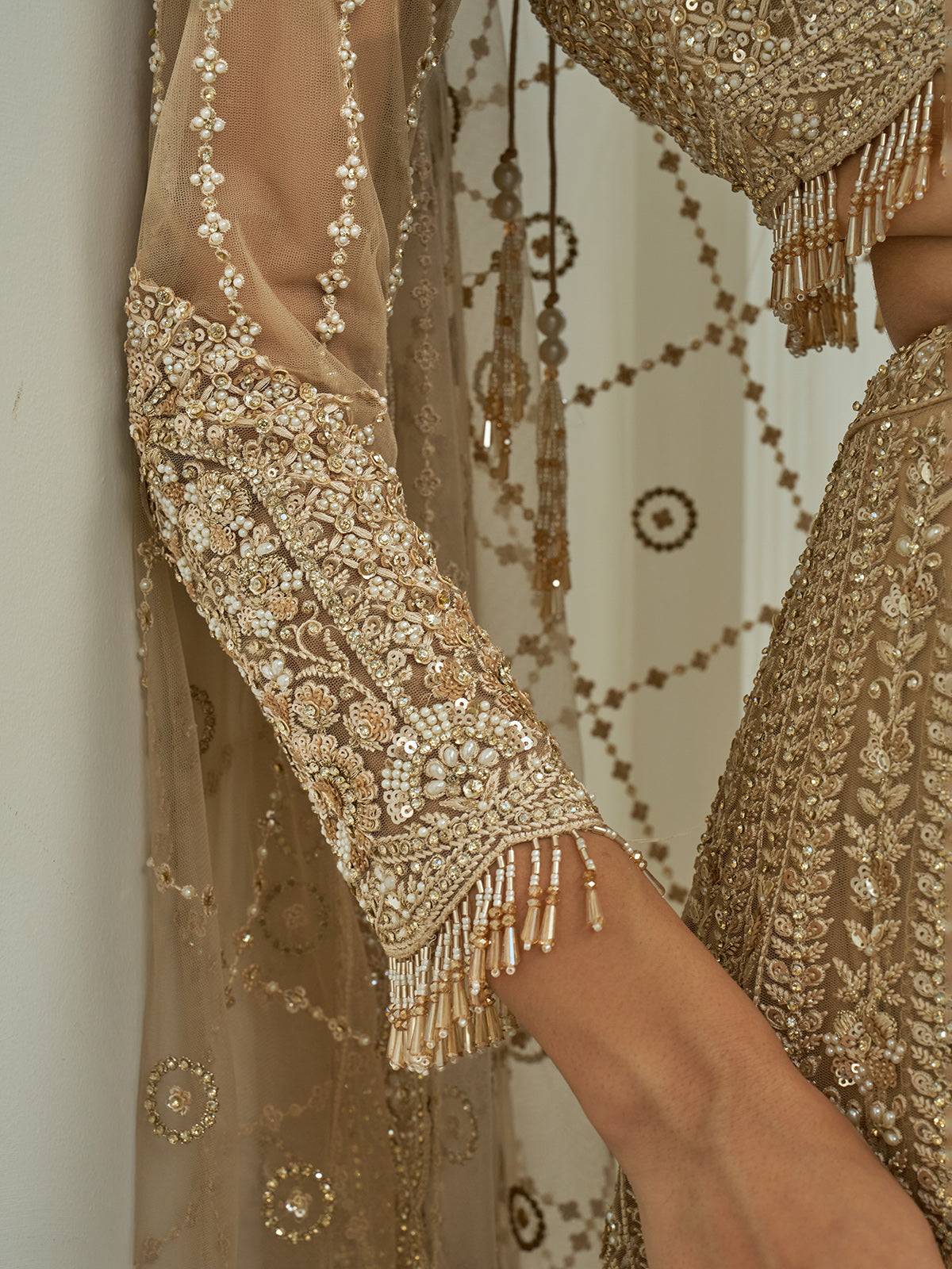 Beige net heavy embroidered lehenga choli with diamond and cutdana