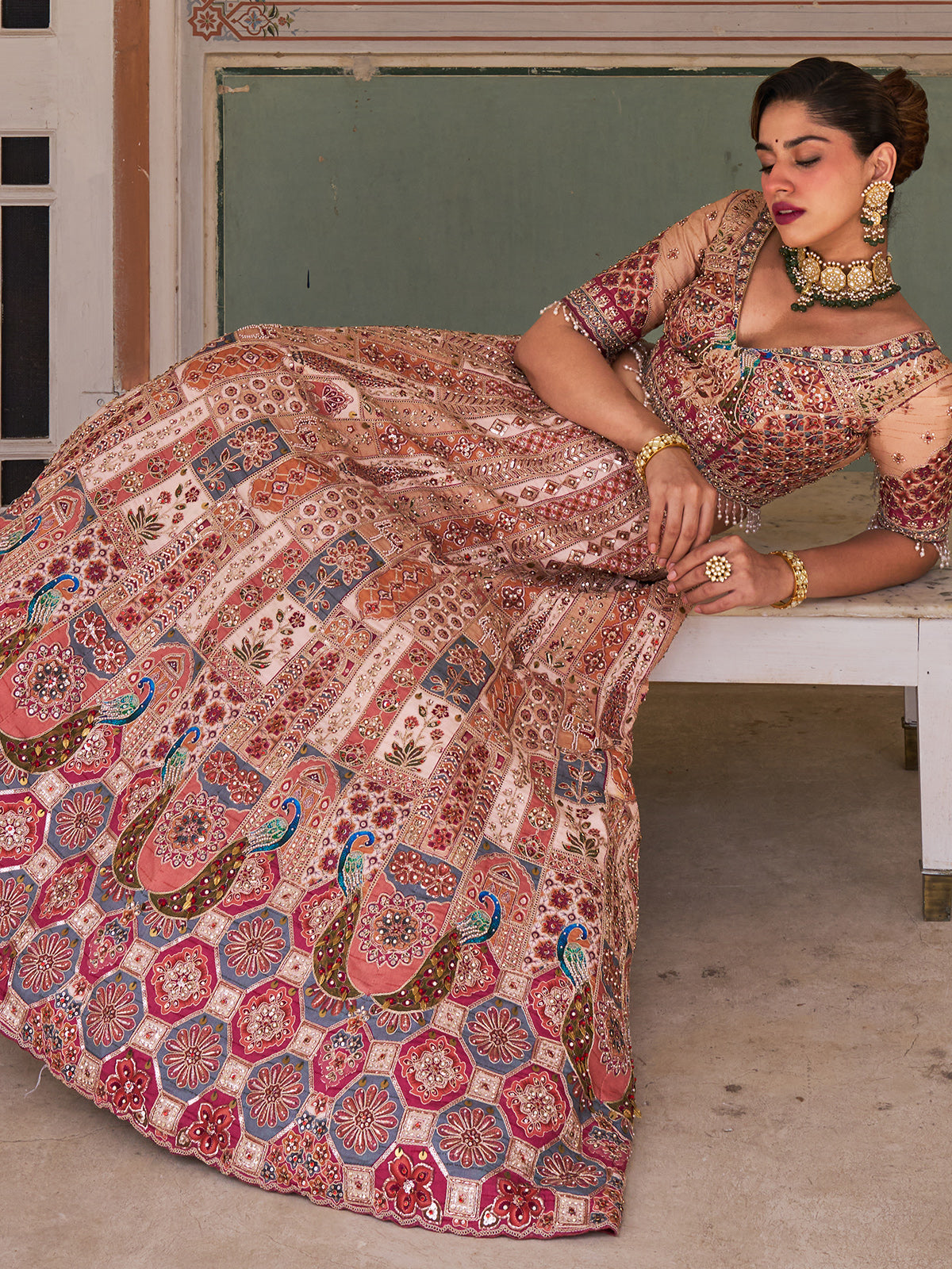 Cream silk net designer lehenga choli with multicolor resham work