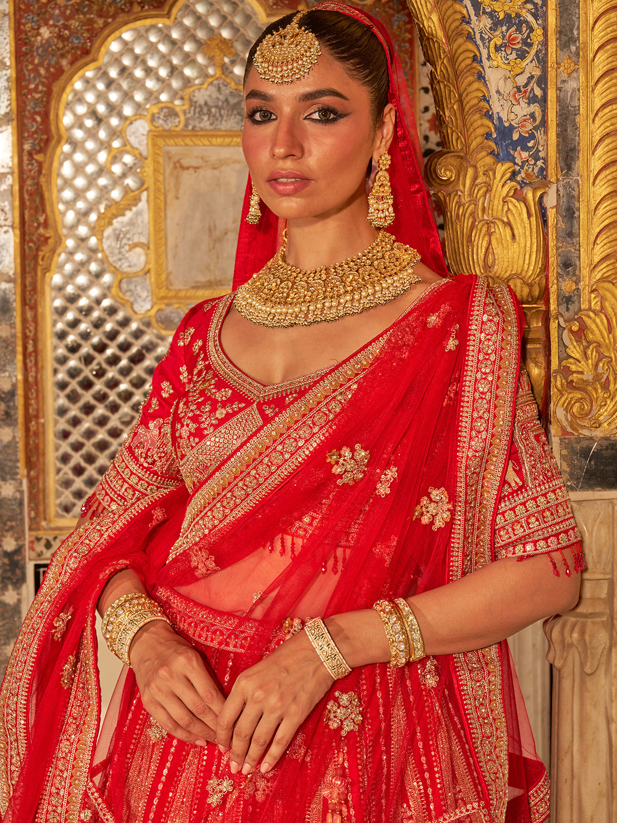 Red silk net bridal lehenga choli with traditional work