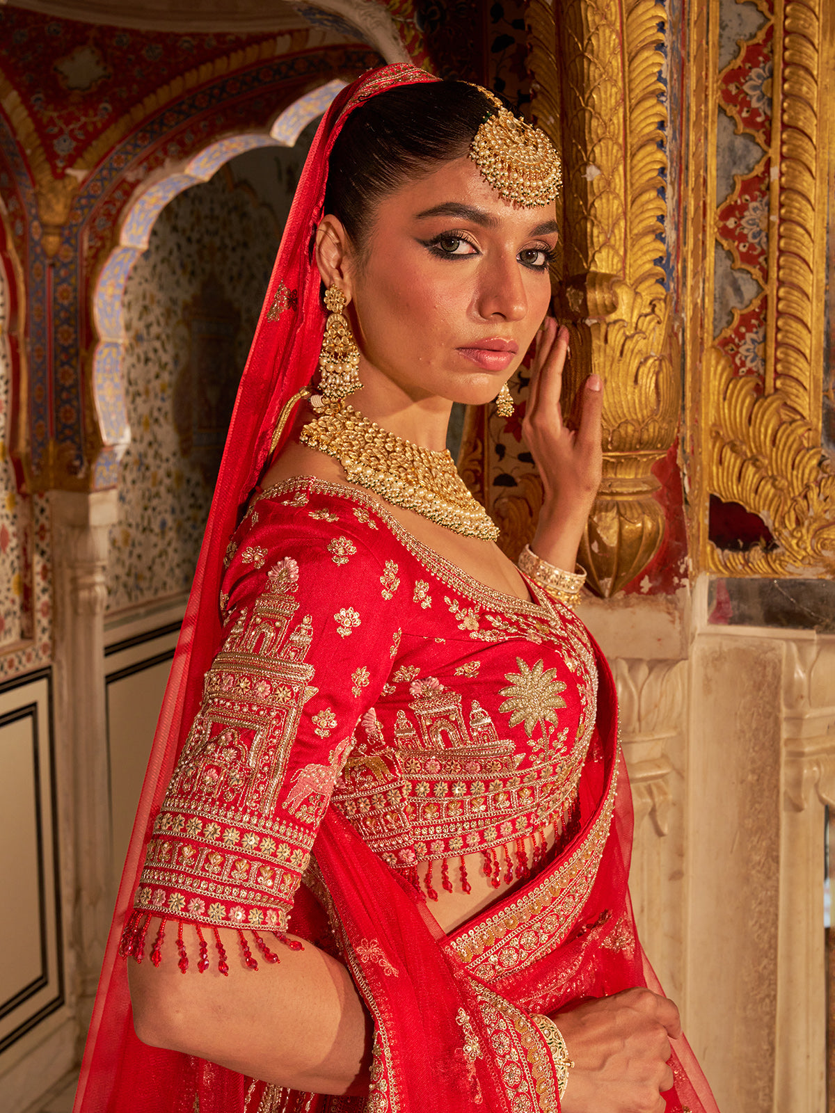 Red silk net bridal lehenga choli with traditional work