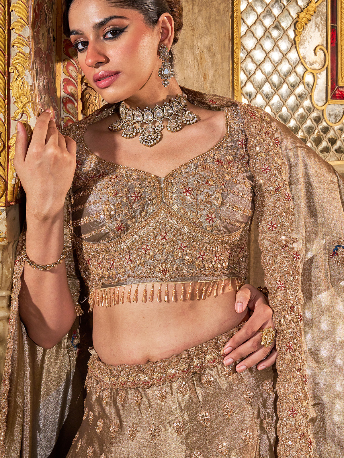 Gold and grey silk lehenga choli with dabka and peacock motifs