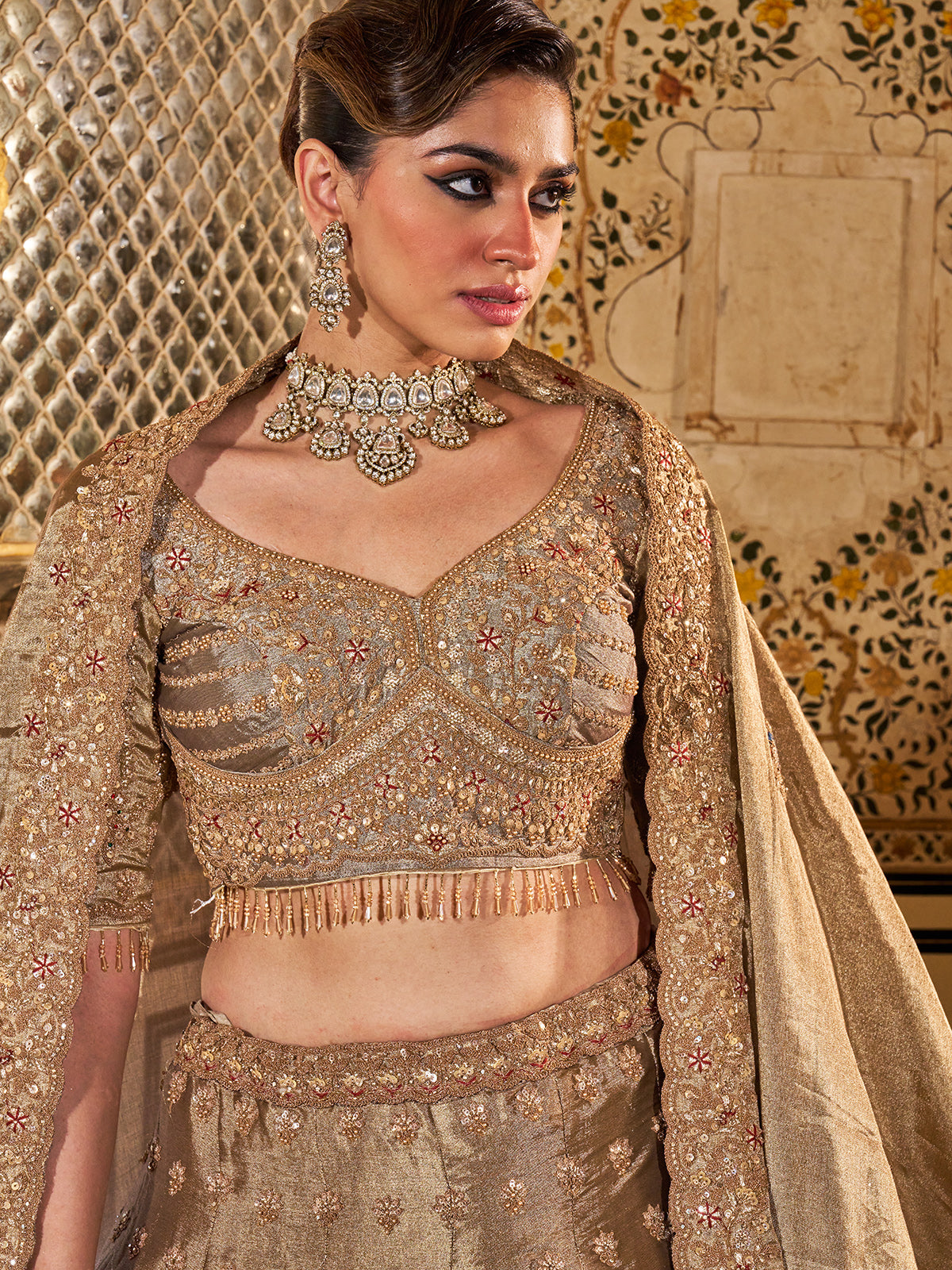 Gold and grey silk lehenga choli with dabka and peacock motifs
