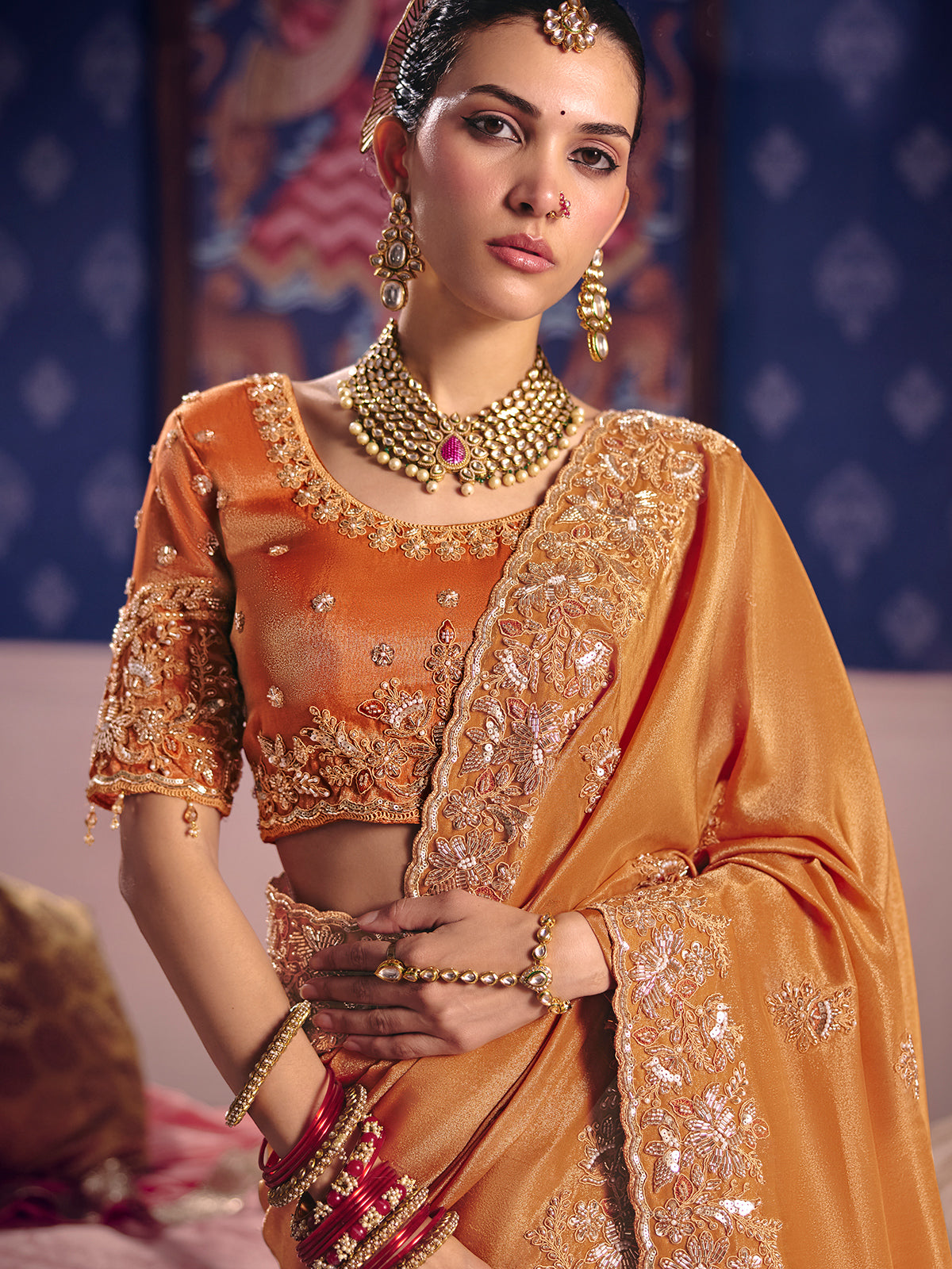 Pastel orange viscose zari tissue saree with embellished border