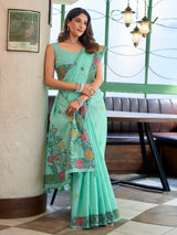 Sophisticated seafoam green cotton linen saree with floral design