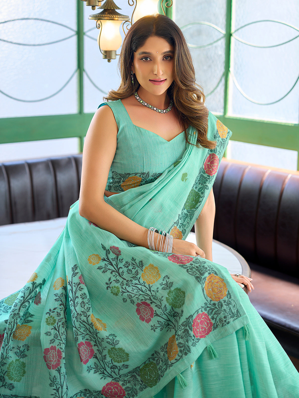 Sophisticated seafoam green cotton linen saree with floral design