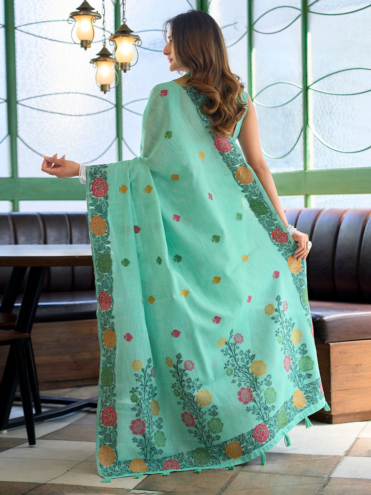Sophisticated seafoam green cotton linen saree with floral design