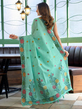 Sophisticated seafoam green cotton linen saree with floral design