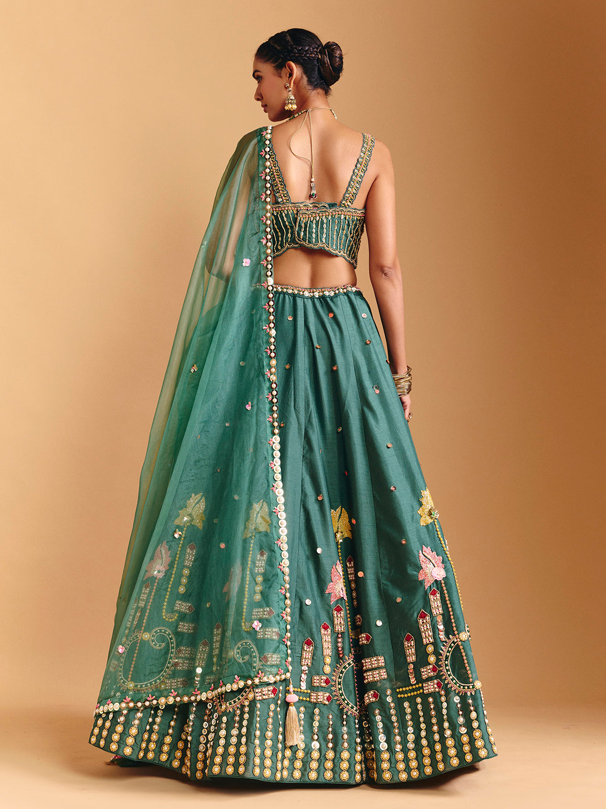 Green raw silk lehenga choli with pearl embellishments