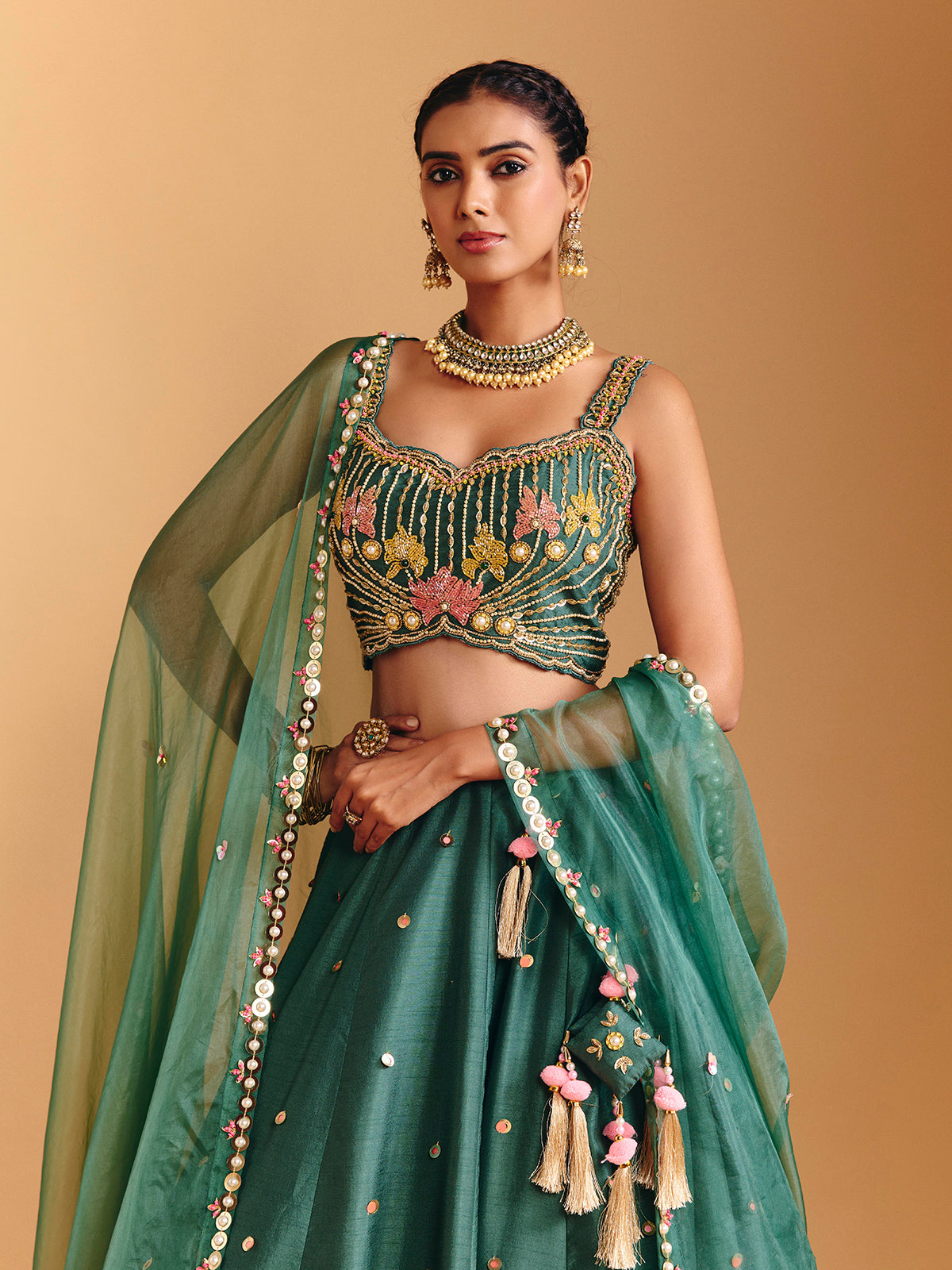 Green raw silk lehenga choli with pearl embellishments