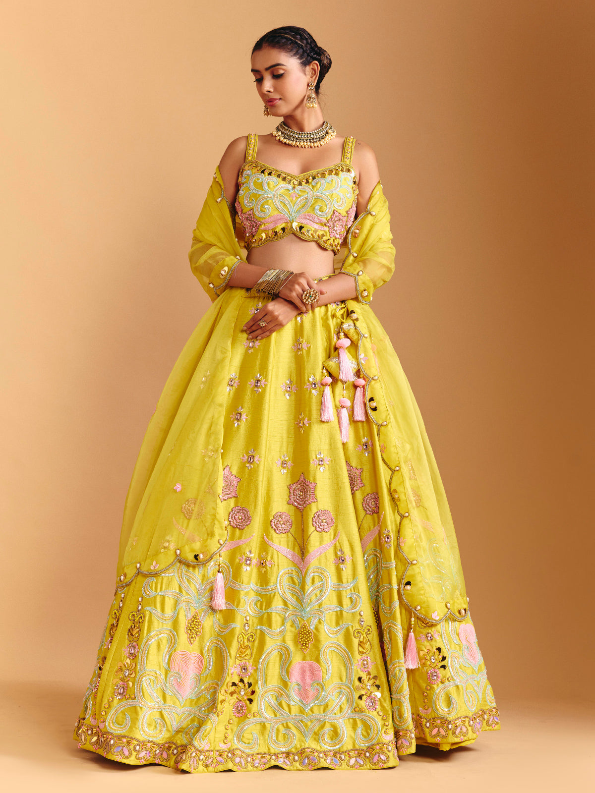 Yellow raw silk lehenga choli with mirror embellishments