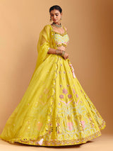 Yellow raw silk lehenga choli with mirror embellishments