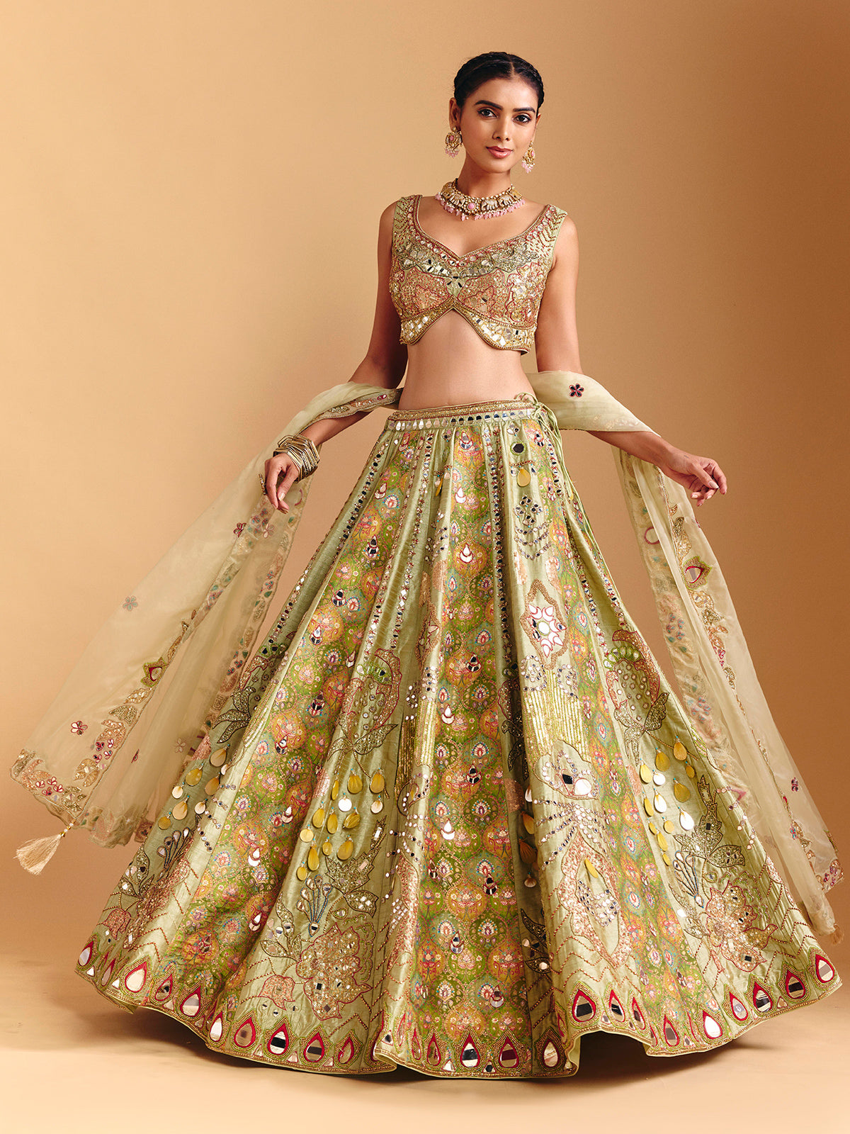 Pista green raw silk lehenga choli with printed artistry