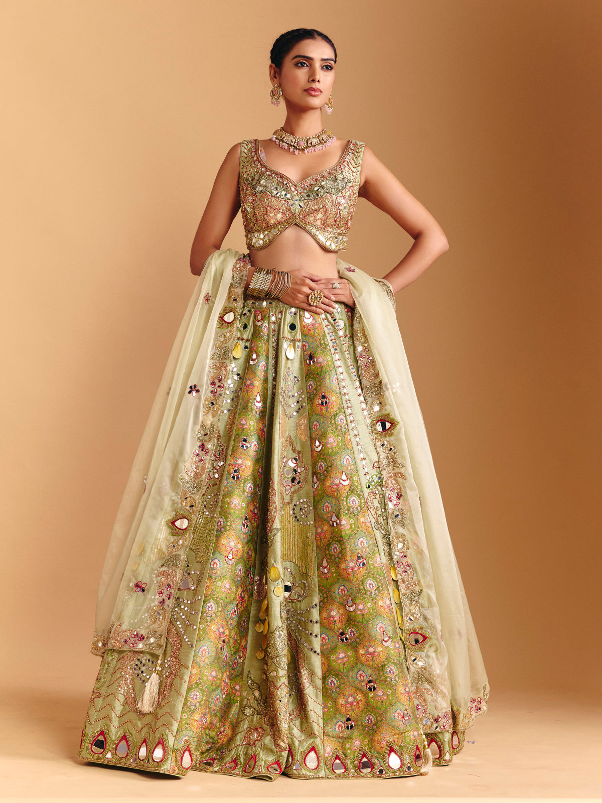 Pista green raw silk lehenga choli with printed artistry