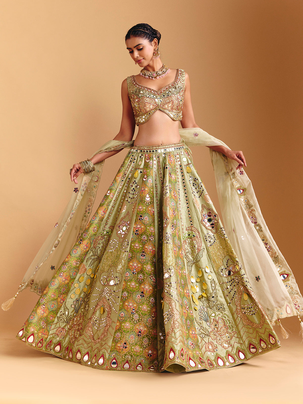 Pista green raw silk lehenga choli with printed artistry
