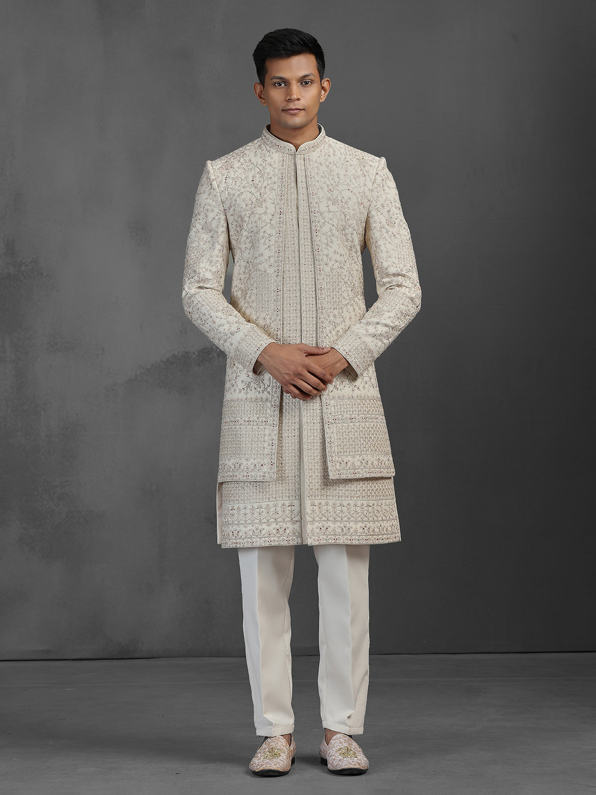 Beige silk groom sherwani with intricate embroidery