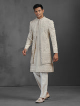 Beige silk groom sherwani with intricate embroidery