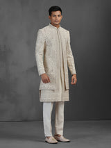 Beige silk groom sherwani with intricate embroidery