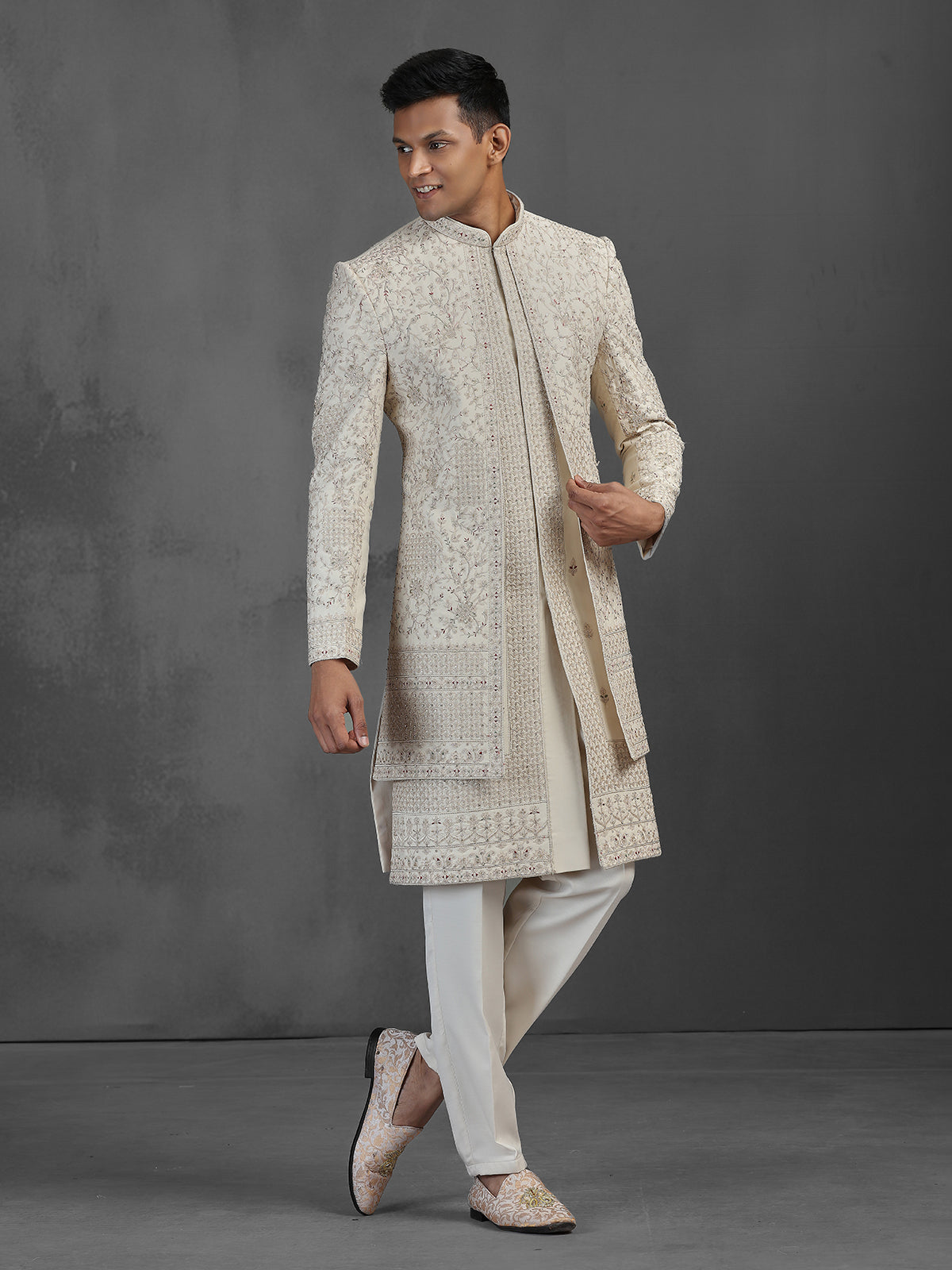 Beige silk groom sherwani with intricate embroidery