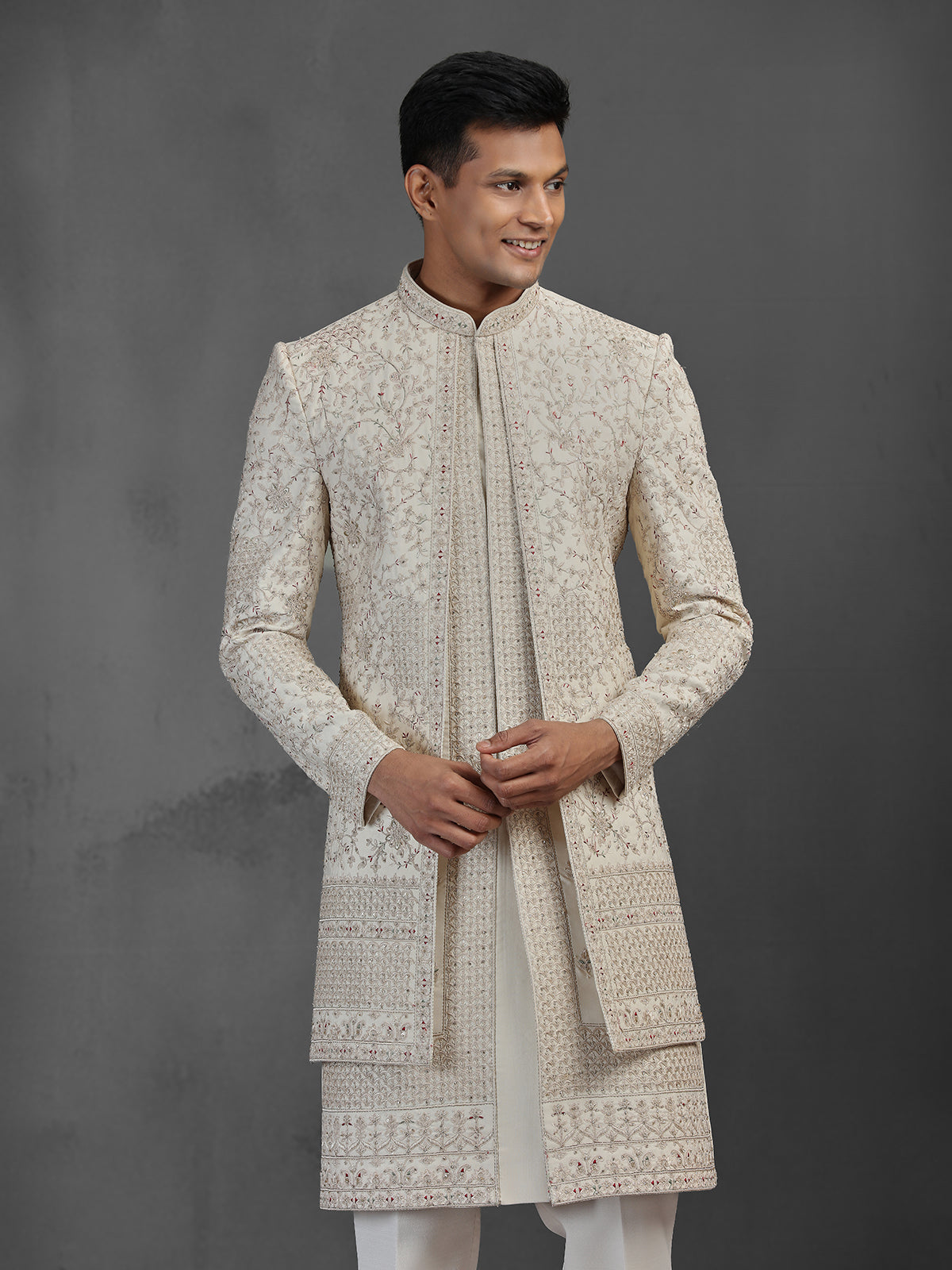 Beige silk groom sherwani with intricate embroidery