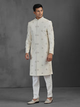 Cream silk wedding sherwani with butti work