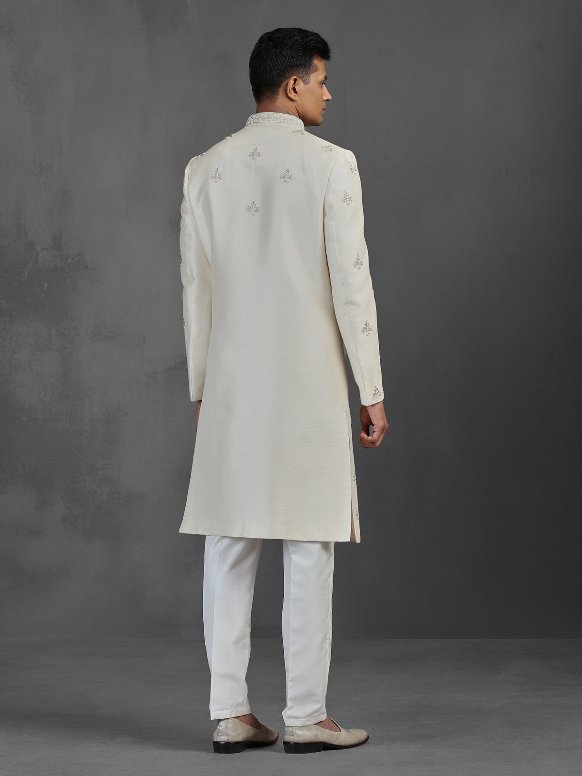 Cream silk wedding sherwani with butti work