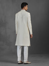 Cream silk wedding sherwani with butti work