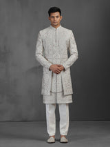 Cream silk groom sherwani with waist belt