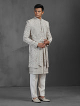 Cream silk groom sherwani with waist belt
