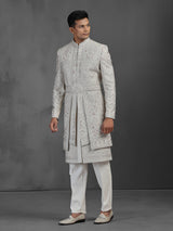 Cream silk groom sherwani with waist belt