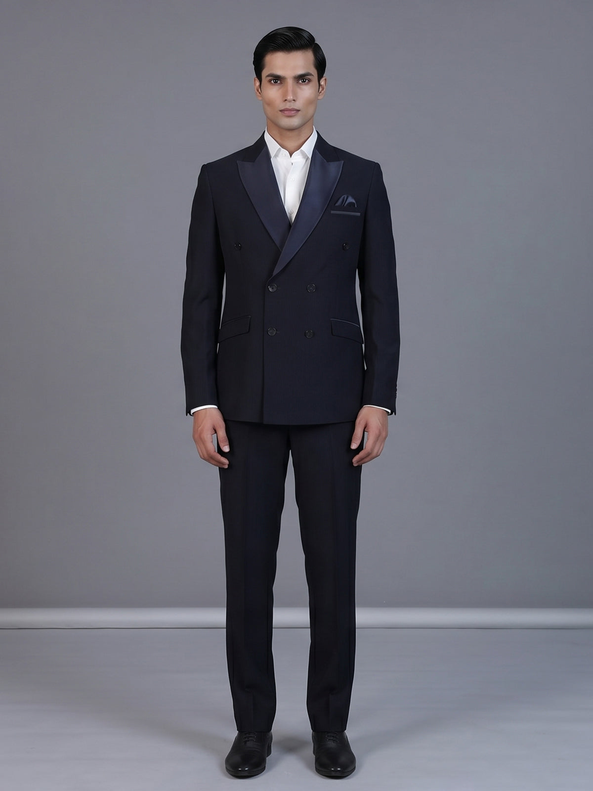 Navy blue designer double breasted suit with satin peak lapel finish
