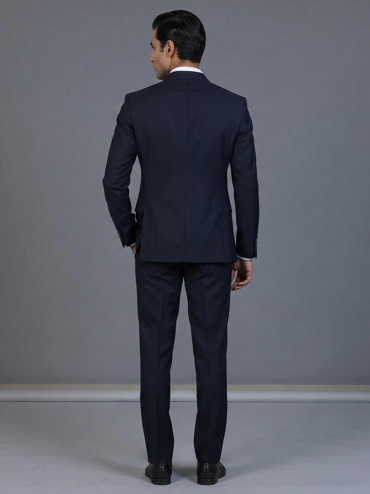 Elegant navy blue formal double breasted suit with peak lapel