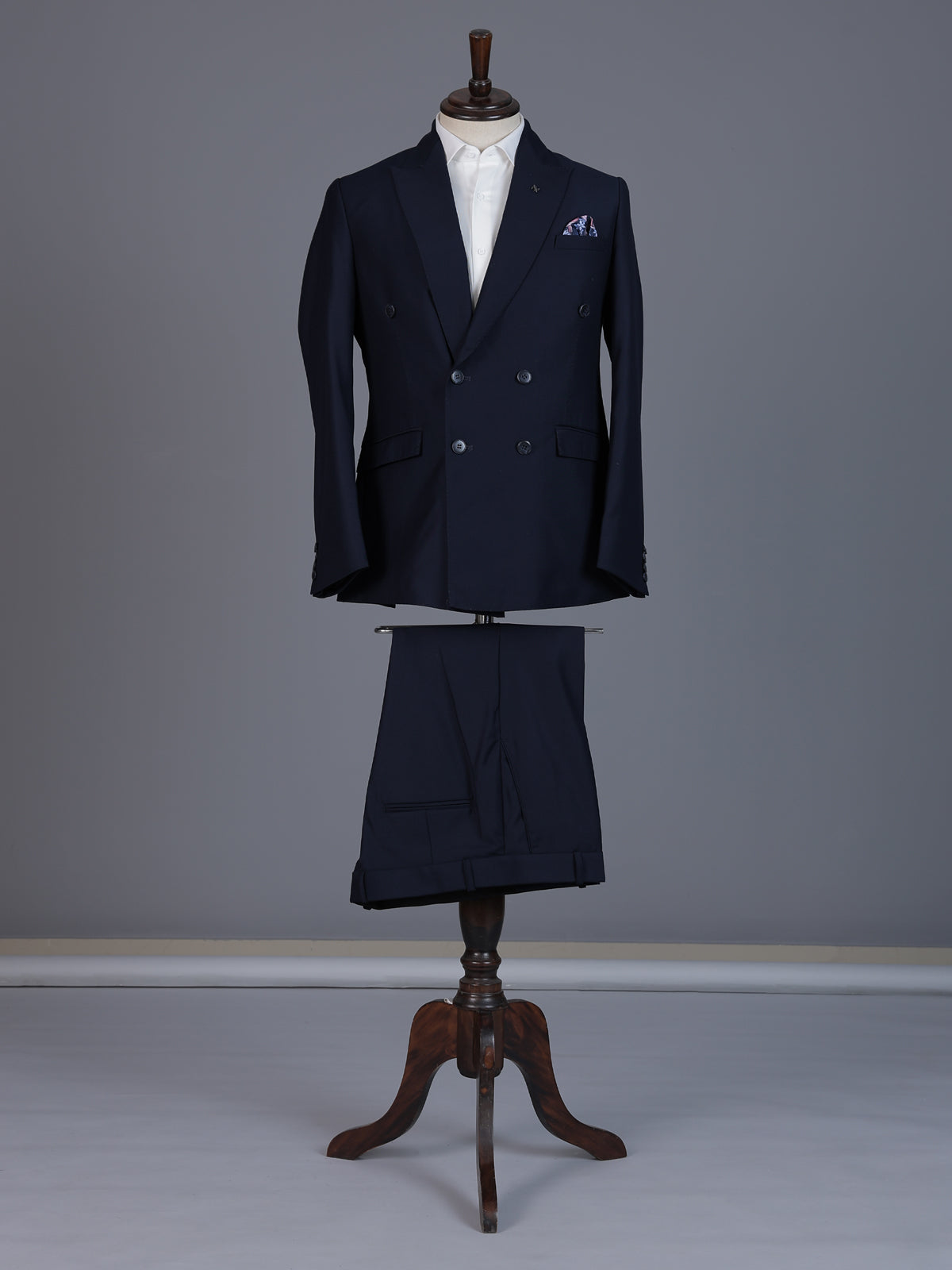 Elegant navy blue formal double breasted suit with peak lapel