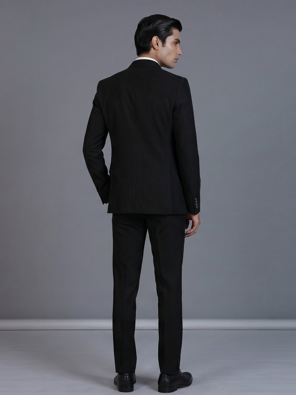 Black pinstripe formal double breasted suit with wide peak lapel