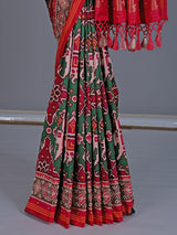 Green art patola silk saree with elephant motif detailing