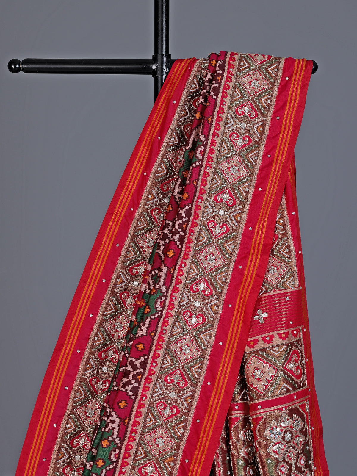 Green art patola silk saree with elephant motif detailing