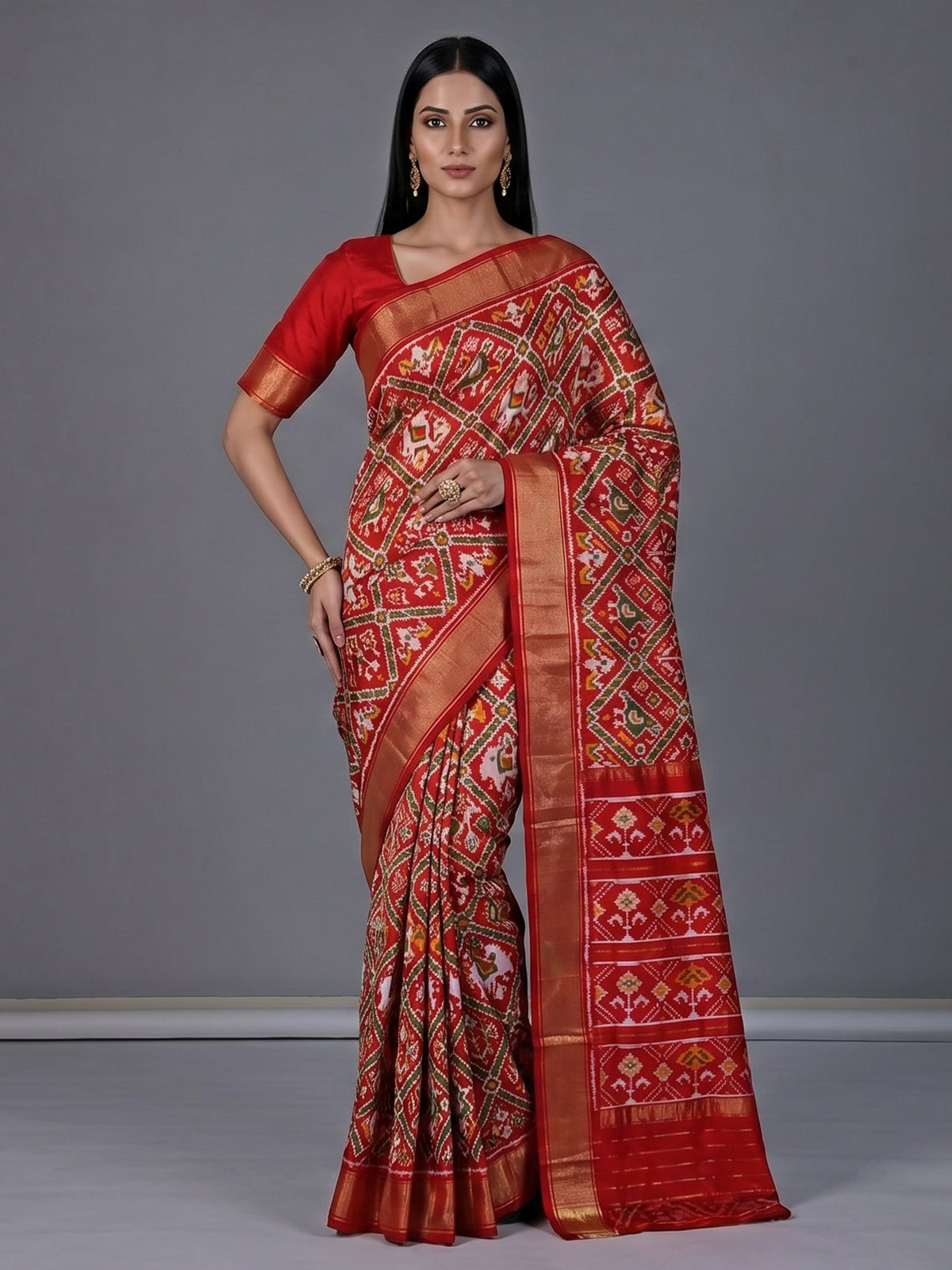 Red patola silk saree with contrast zari border