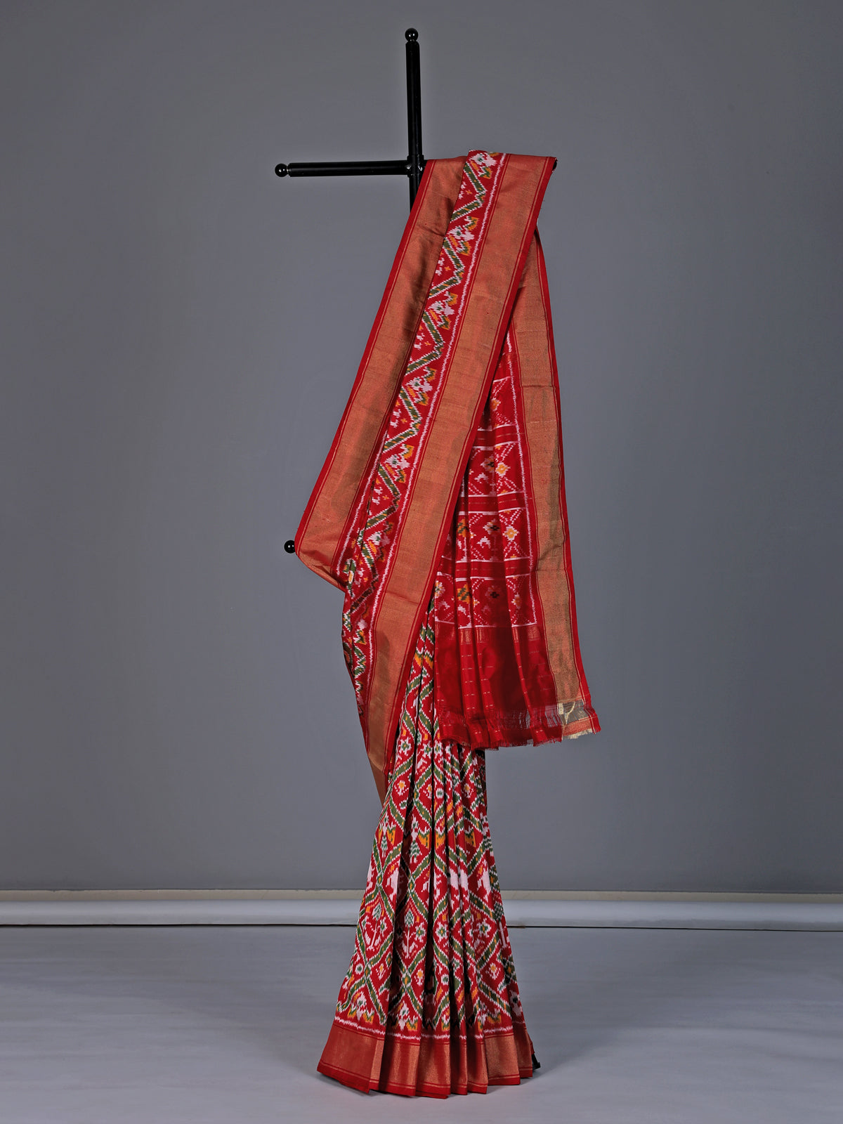 Red patola silk saree with contrast zari border