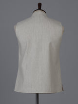 Beige linen waistcoat with brooch detailing
