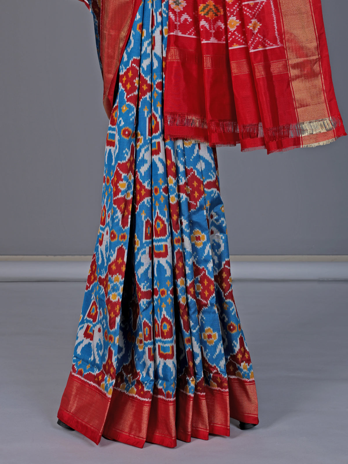 Blue patola silk saree with elephant motif border