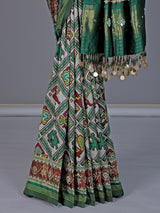 Green and white patola silk saree with rich embellishments