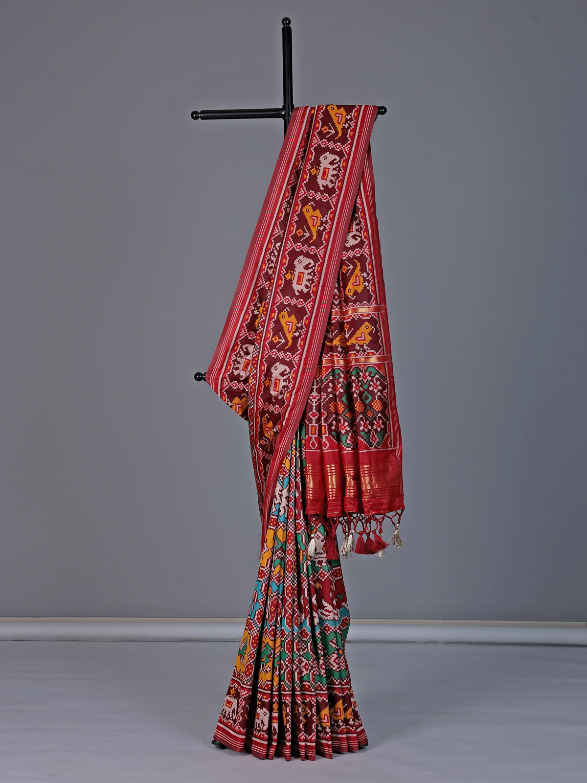 Maroon patola silk saree with zari pallu design
