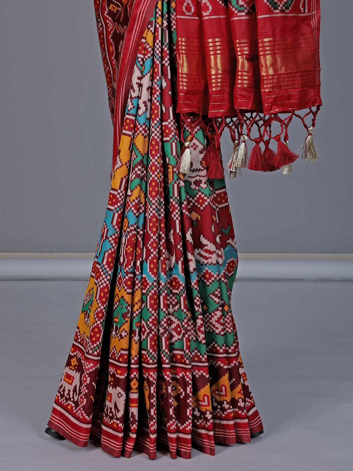 Maroon patola silk saree with zari pallu design