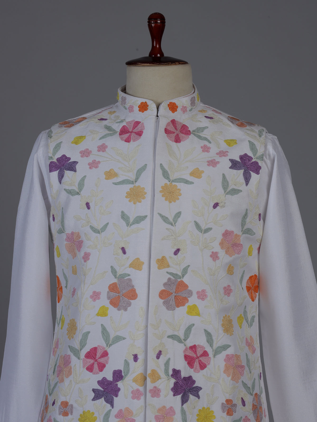 White silk waistcoat set with colorful floral thread
