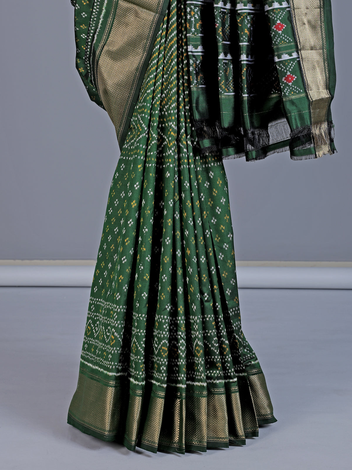 Dark green pure hyderabadi patola silk saree with zari border