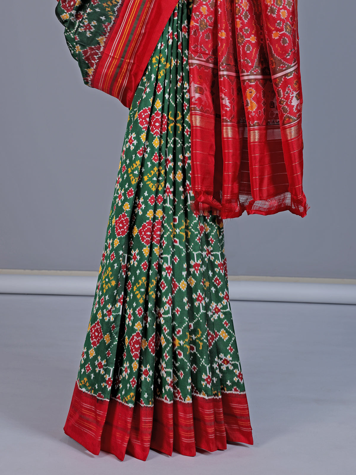 Green pure hyderabadi patola silk saree with elephant bird motif pallu