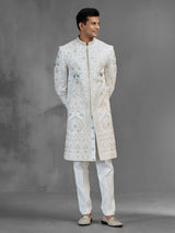 Cream silk sherwani with aqua peacock thread work design