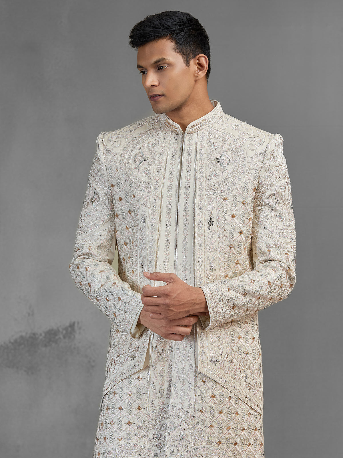 Beige silk open front sherwani with rich embroidery