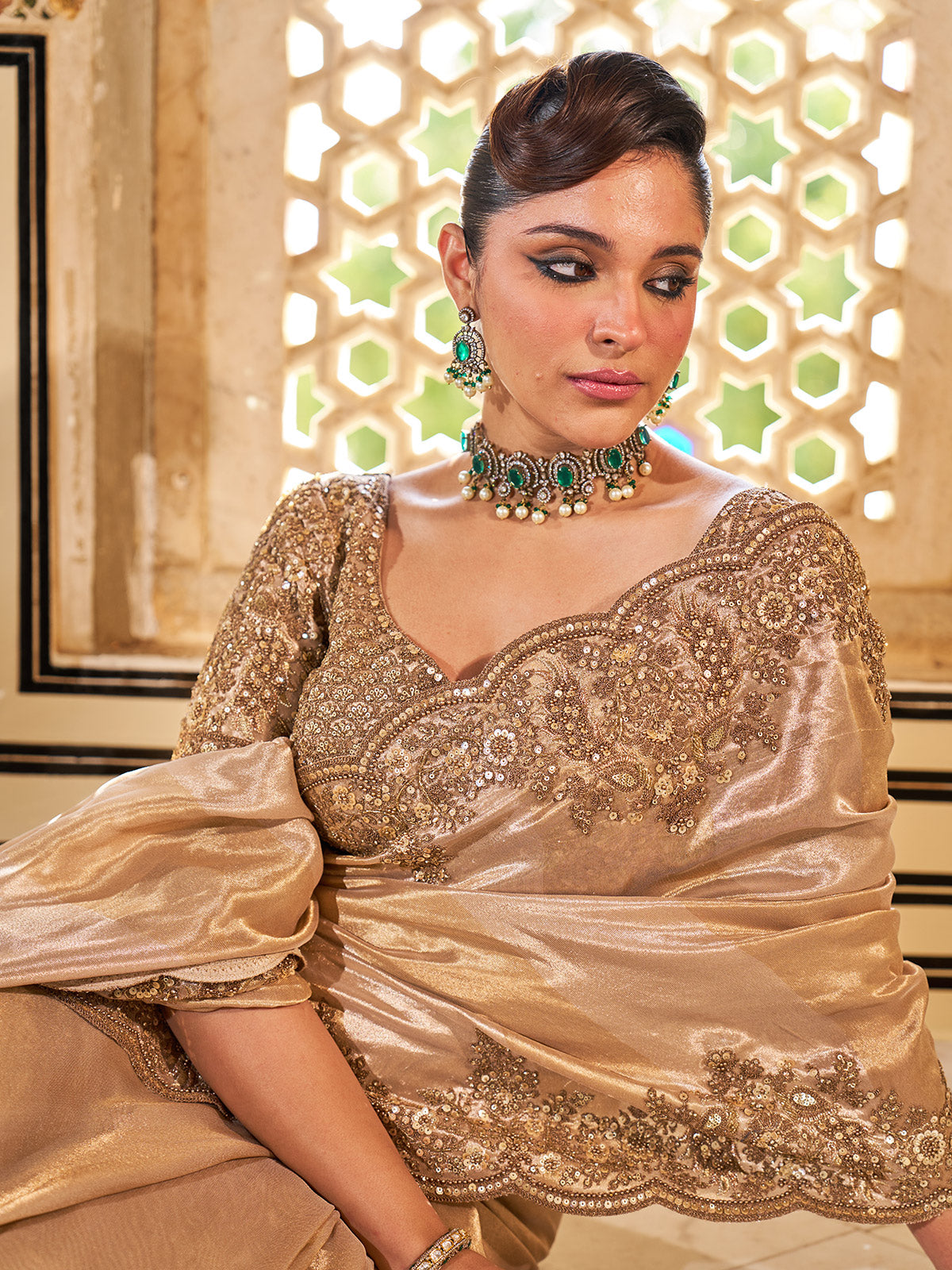 Gold shimmer tissue silk saree with subtle textured drape