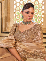 Gold shimmer tissue silk saree with subtle textured drape