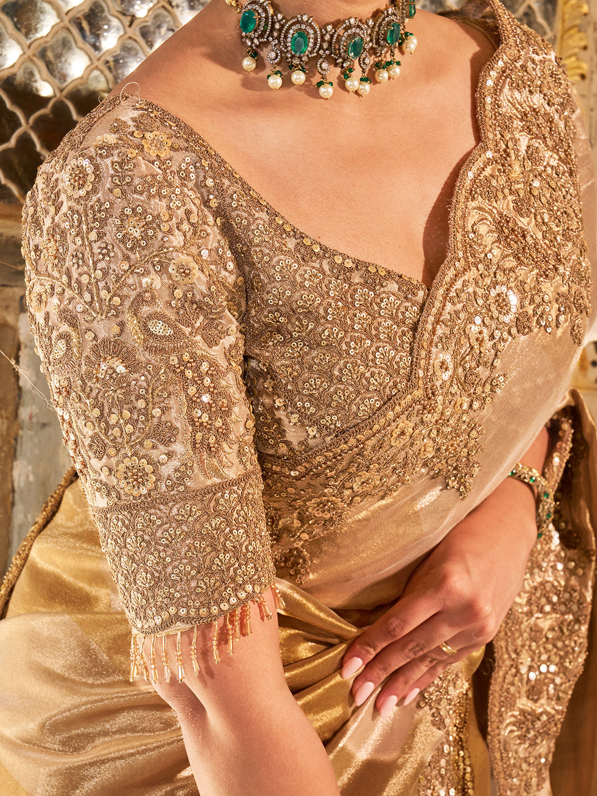Gold shimmer tissue silk saree with subtle textured drape